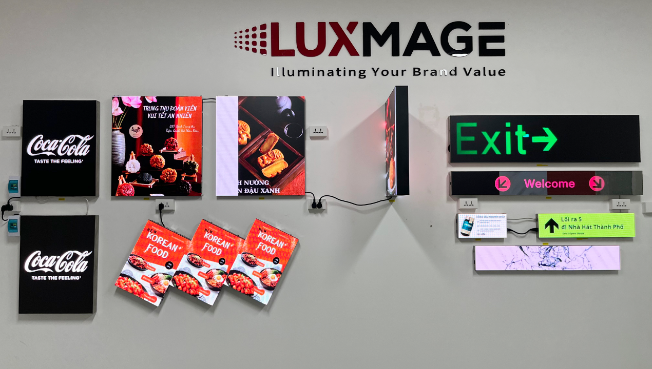 Compact LED screen mounted on cosmetic booth, displaying instruction video.